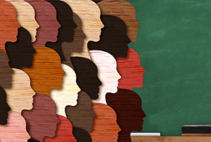 diverse colors of head silhouettes on top of chalkboard